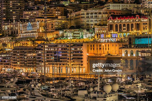 Downtown apartments and marina yachts at night.