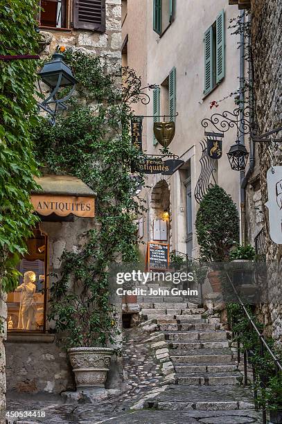 Rustic stone steps and shops in the medieval village.