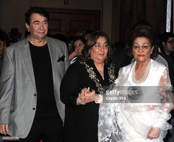 Indian Bollywood film actor Randhir Kapoor with sister Reema Jain and mother Krishna Kapoor attend the music launch of the upcoming Hindi film 'Lekar...