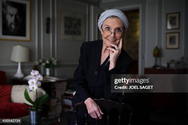 French writer Catherine Robbe-Grillet poses at her home in Neuilly-sur-Seine, near Paris, on June 12, 2014. AFP PHOTO / JOEL SAGET