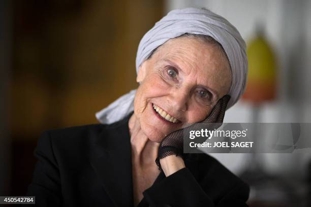 French writer Catherine Robbe-Grillet poses at her home in Neuilly-sur-Seine, near Paris, on June 12, 2014. AFP PHOTO / JOEL SAGET