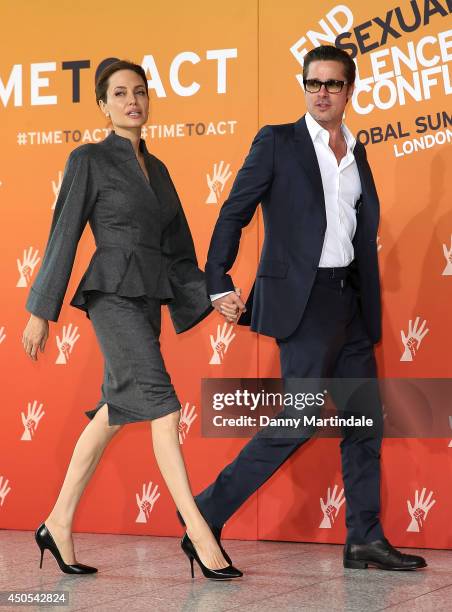 Brad Pitt and US actress and UN special envoy Angelina Jolie attend the Global Summit to end Sexual Violence in Conflict at ExCel on June 13, 2014 in...