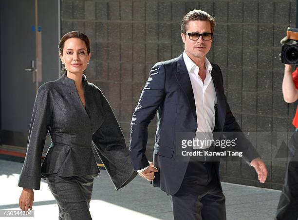 Angelina Jolie and Brad Pitt attend the Global Summit to end Sexual Violence in Conflict at ExCel on June 13, 2014 in London, England.