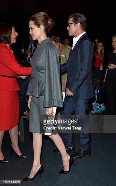 Angelina Jolie and Brad Pitt attend the Global Summit to end Sexual Violence in Conflict at ExCel on June 13, 2014 in London, England.