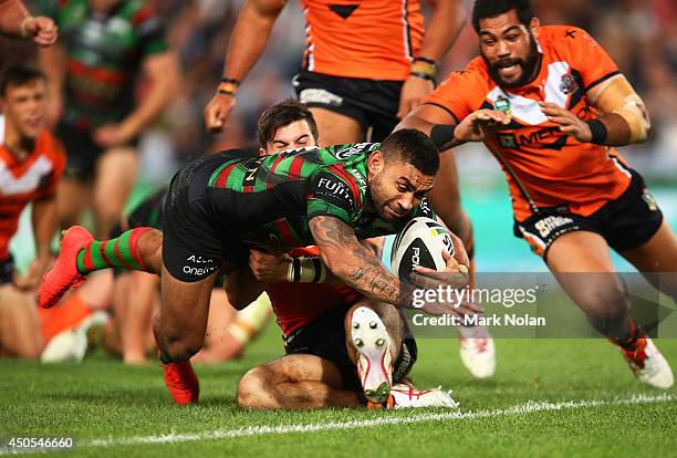 Nathan Merritt of the Rabbitohs dives to score a try during the round 14 NRL match between the South Sydney Rabbitohs and the Wests Tigers at ANZ...