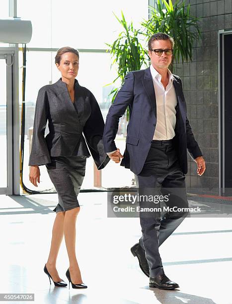 Special Envoy and actress Angelina Jolie and Actor Brad Pitt attend the Global Summit to End Sexual Violence in Conflict at ExCel on June 13, 2014 in...