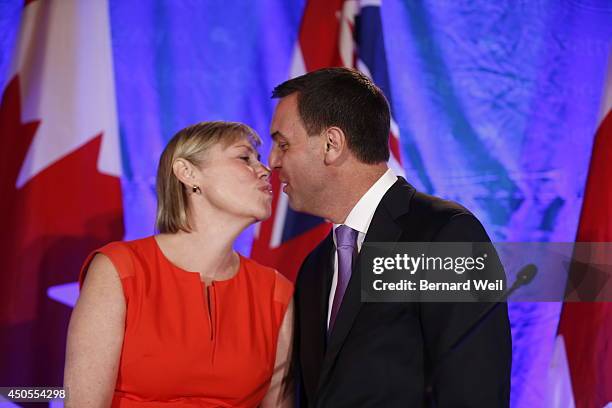 Ontario Progressive Conservative leader Tim Hudak, right, announces next to his wife Deb Hutton that he will be stepping down as party leader after...