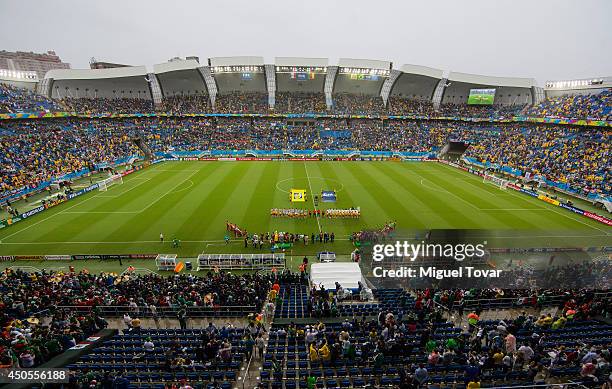 General view as the teams line up for the national anthems prior to the 2014 FIFA World Cup Brazil Group A match between Mexico and Cameroon at...