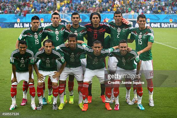 Mexico players pose for a team photo before the 2014 FIFA World Cup Brazil Group A match between Mexico and Cameroon at Estadio das Dunas on June 13,...