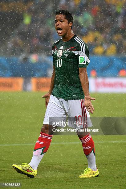 Giovani dos Santos of Mexico reacts after his goal was disallowed due to an offsides call in the first half during the 2014 FIFA World Cup Brazil...