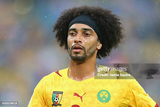 Benoit Assou-Ekotto of Cameroon looks on during the 2014 FIFA World Cup Brazil Group A match between Mexico and Cameroon at Estadio das Dunas on June...