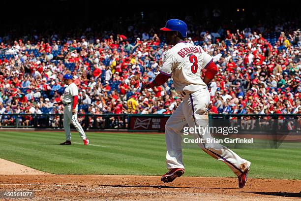 Roger Bernadina of the Philadelphia Phillies turns to guide a team member home after he scored a run during the game against the Arizona Diamondbacks...