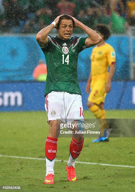 Javier Hernandez of Mexico reacts to a missed chance during the 2014 FIFA World Cup Brazil Group A match between Mexico and Cameroon at Estadio das...