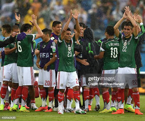 Mexico players celebrate victory after the 2014 FIFA World Cup Brazil Group A match between Mexico and Cameroon at Estadio das Dunas on June 13, 2014...