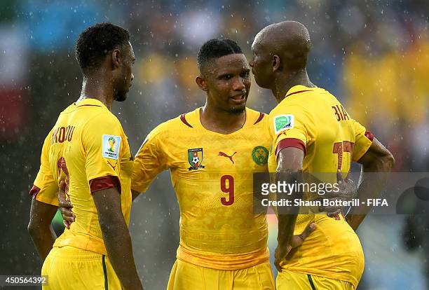 Samuel Eto'o of Cameroon consoles Nicolas N'Koulou and Stephane Mbia after the 2014 FIFA World Cup Brazil Group A match between Mexico and Cameroon...