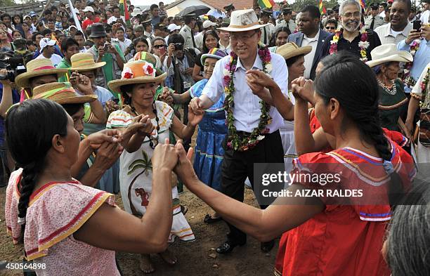Secretary General Ban Ki Moon dances with Guarani indigenous women during a visit to Santa Rita community, in Concepcion municipality, 310 Km from...