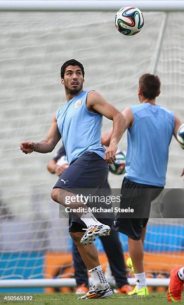 Luis Suarez keeps a close eye on the ball during the Uruguay Training session at Castelao on June 13, 2014 in Fortaleza, Brazil.