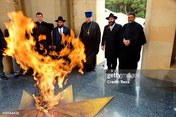 May 9 Martyrs Lane, Baku, Azerbaijan. Christian, Jewish and Muslim representatives stand around the Eternal Flame memorial at Martyrs Lane. Many...