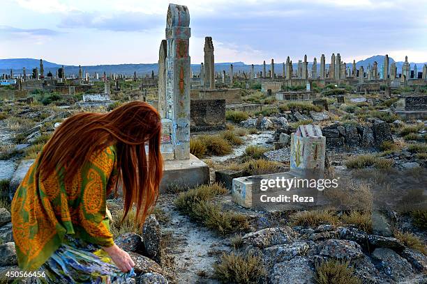 August 10 Sofi Hamid Cemetery, South of Baku, Azerbaijan. A Sufi, Azerbaijani painter visits the Sofi Hamid cemetery. The Azerbaijani people believe...