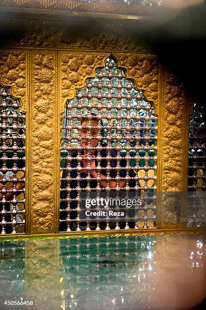 August 6 Mir Movsum Agha Sanctuary, Shuvelan, Baku, Azerbaijan. A Muslim woman visits Mir Movsum Agha, the most important sanctuary in all of...