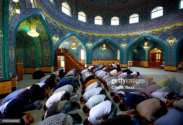 August 9 Mir Movsum Agha Sanctuary, Shuvelan, Baku, Azerbaijan. On the last day of Ramadan, known as Eid al-Fitr, Muslim men recite the special...