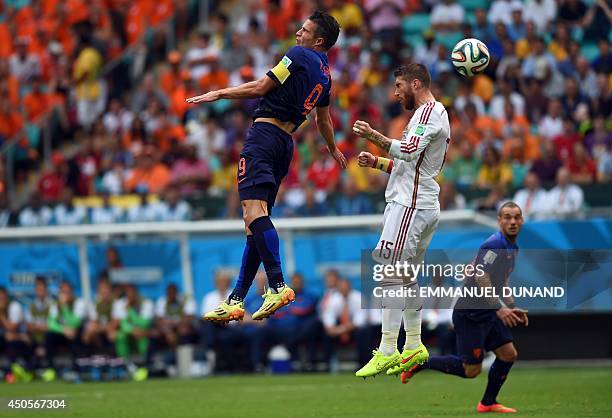 Netherlands' forward Robin van Persie vies with Spain's defender Sergio Ramos during a Group B football match between Spain and the Netherlands at...