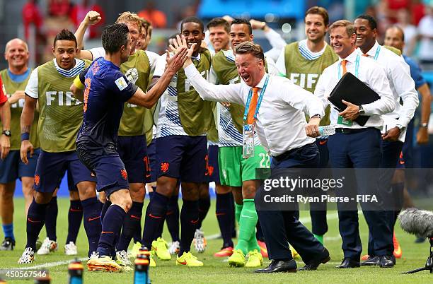 Robin van Persie of the Netherlands celebrates with coach Louis van Gaal of the Netherlands after scoring a goal during the 2014 FIFA World Cup...