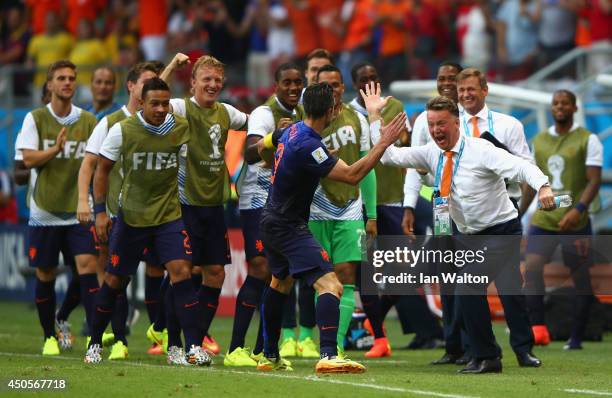 Robin van Persie of the Netherlands celebrates with head coach Louis van Gaal of the Netherlands after scoring the team's first goal in the first...