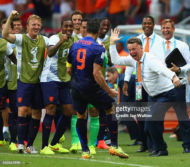 Robin van Persie of the Netherlands celebrates with head coach Louis van Gaal of the Netherlands after scoring the team's first goal in the first...