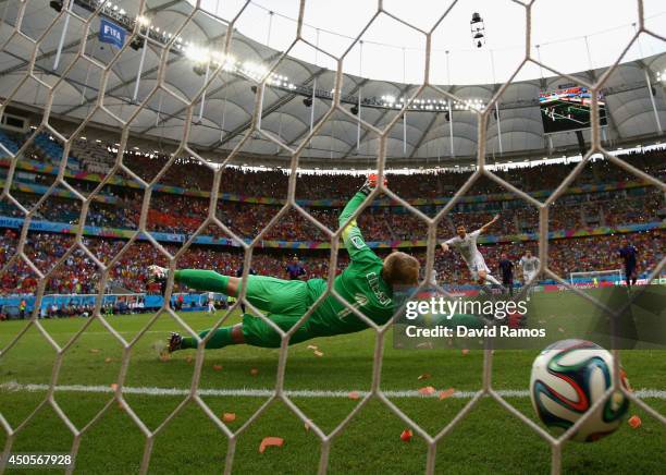 Xabi Alonso of Spain shoots and scores a goal on a penalty kick against goalkeeper Jasper Cillessen of the Netherlands in the first half during the...