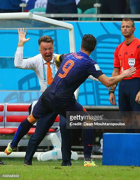 Robin van Persie of the Netherlands celebrates with head coach Louis van Gaal after scoring the team's first goal in the first half during the 2014...