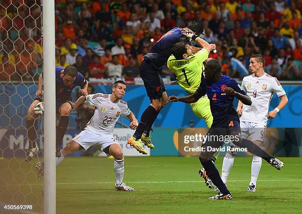 Stefan de Vrij of the Netherlands deflects the ball in for the teams third goal as Iker Casillas of Spain and Robin van Persie of the Netherlands...