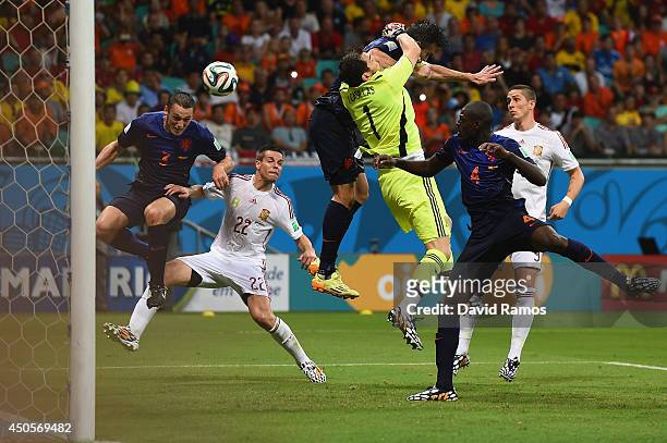 Stefan de Vrij of the Netherlands deflects the ball in for the teams third goal as Iker Casillas of Spain and Robin van Persie of the Netherlands...