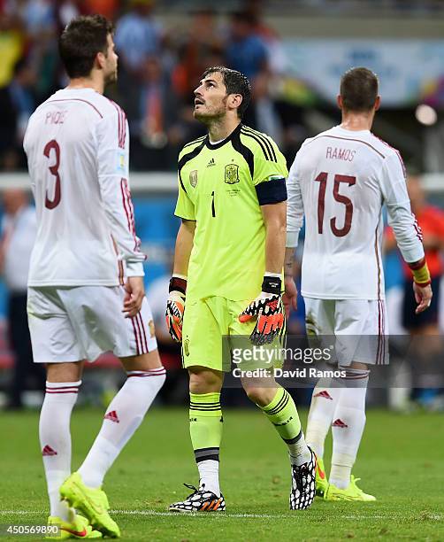 Iker Casillas of Spain reacts after allowing the third goal during the 2014 FIFA World Cup Brazil Group B match between Spain and Netherlands at...