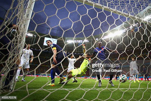 Robin van Persie and Bruno Martins Indi of the Netherlands watch as teammate Stefan de Vrij of the Netherlands scores the team's third goal against...