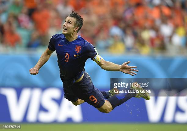 Netherlands' forward Robin van Persie scores during a Group B football match between Spain and the Netherlands at the Fonte Nova Arena in Salvador...