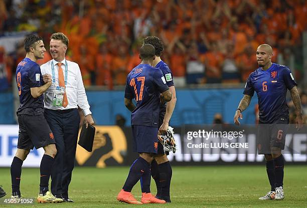 Netherlands' forward Robin van Persie celebrate with Netherlands' coach Louis van Gaal at the end of a Group B football match between Spain and the...