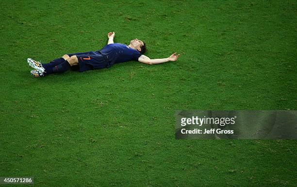 Daryl Janmaat of the Netherlands lies on the field at the end of the match during the 2014 FIFA World Cup Brazil Group B match between Spain and...