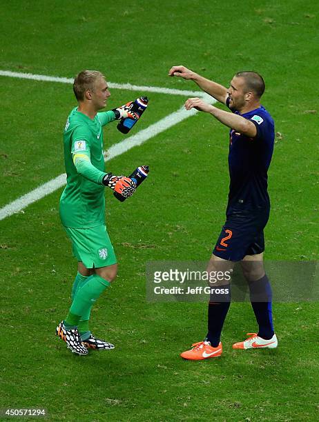 Goalkeeper Jasper Cillessen and Ron Vlaar of the Netherlands celebrate after defeating Spain 5-1 during the 2014 FIFA World Cup Brazil Group B match...