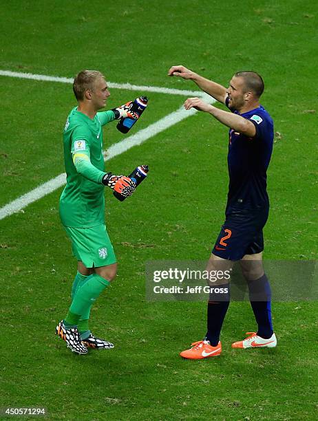 Goalkeeper Jasper Cillessen and Ron Vlaar of the Netherlands celebrate after defeating Spain 5-1 during the 2014 FIFA World Cup Brazil Group B match...