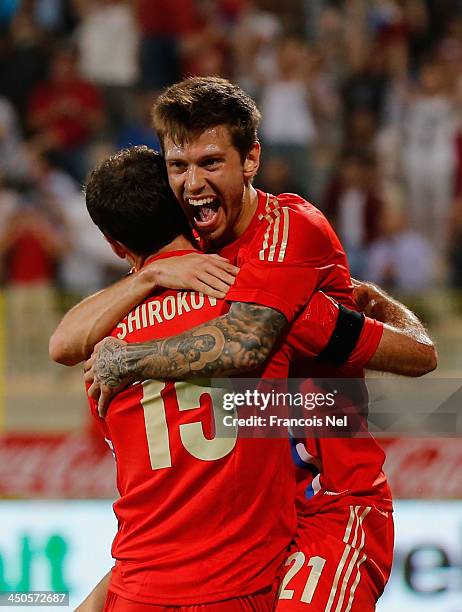 Fyodor Smolov of Russia celebrates his goal with team mate Roman Shirokov during the International friendly match between South Korea and Russia at...