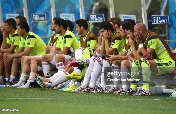 Dejected Spain bench looks on during the 2014 FIFA World Cup Brazil Group B match between Spain and Netherlands at Arena Fonte Nova on June 13, 2014...