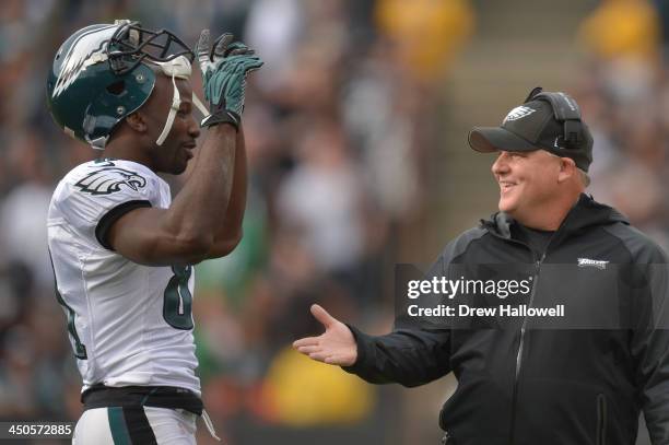 Head coach Chip Kelly of the Philadelphia Eagles greets Jason Avant against the Oakland Raiders at O.co Coliseum on November 3, 2013 in Oakland,...