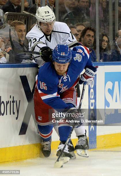 Tyler Toffoli of the Los Angeles Kings pushes Derek Dorsett of the New York Rangers in Game Four of the 2014 Stanley Cup Final at Madison Square...
