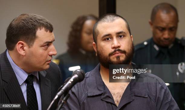 George Zimmerman, the acquitted shooter in the death of Trayvon Martin, listens to defense counsel Daniel Megaro during a first-appearance hearing on...