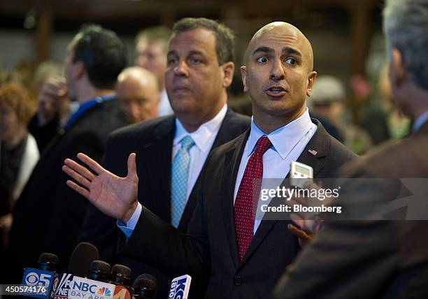 Republican gubernatorial candidate Neel Kashkari, right, speaks to media as Chris Christie, governor of New Jersey, looks on during an event held at...