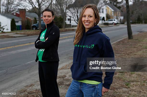 Ali Sherwood of Winthrop, Mass. And Amie Gauthier of Somerville, Mass. Stand at mile 18.64 of the Boston Marathon route in Newton, Mass. On April 13,...