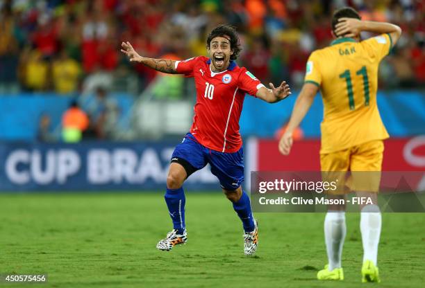 Jorge Valdivia of Chile celebrates after scoring a goal during the 2014 FIFA World Cup Brazil Group B match between Chile and Australia at Arena...