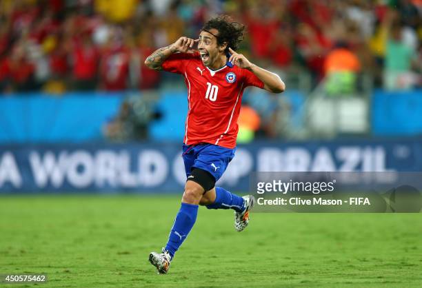 Jorge Valdivia of Chile celebrates after scoring a goal during the 2014 FIFA World Cup Brazil Group B match between Chile and Australia at Arena...