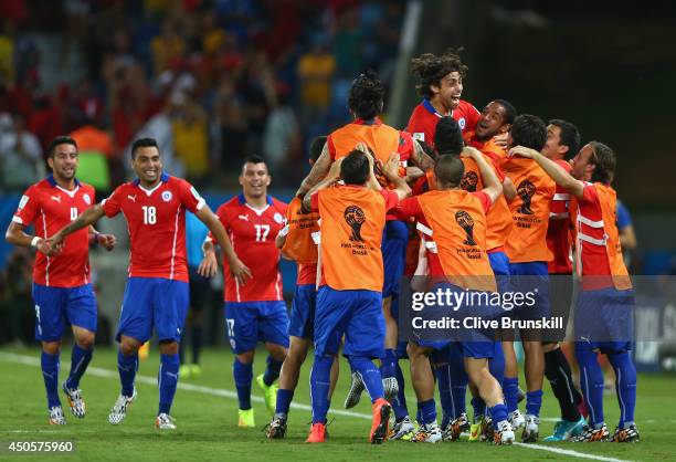 Jorge Valdivia of Chile celebrates scoring the team's second goal with teammates during the 2014 FIFA World Cup Brazil Group B match between Chile...